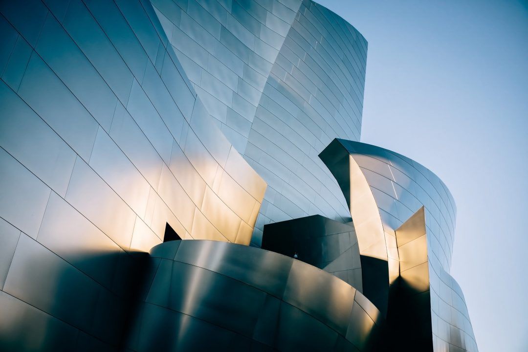 A close-up of the sleek, curved, modern architecture of Walt Disney Concert Hall.