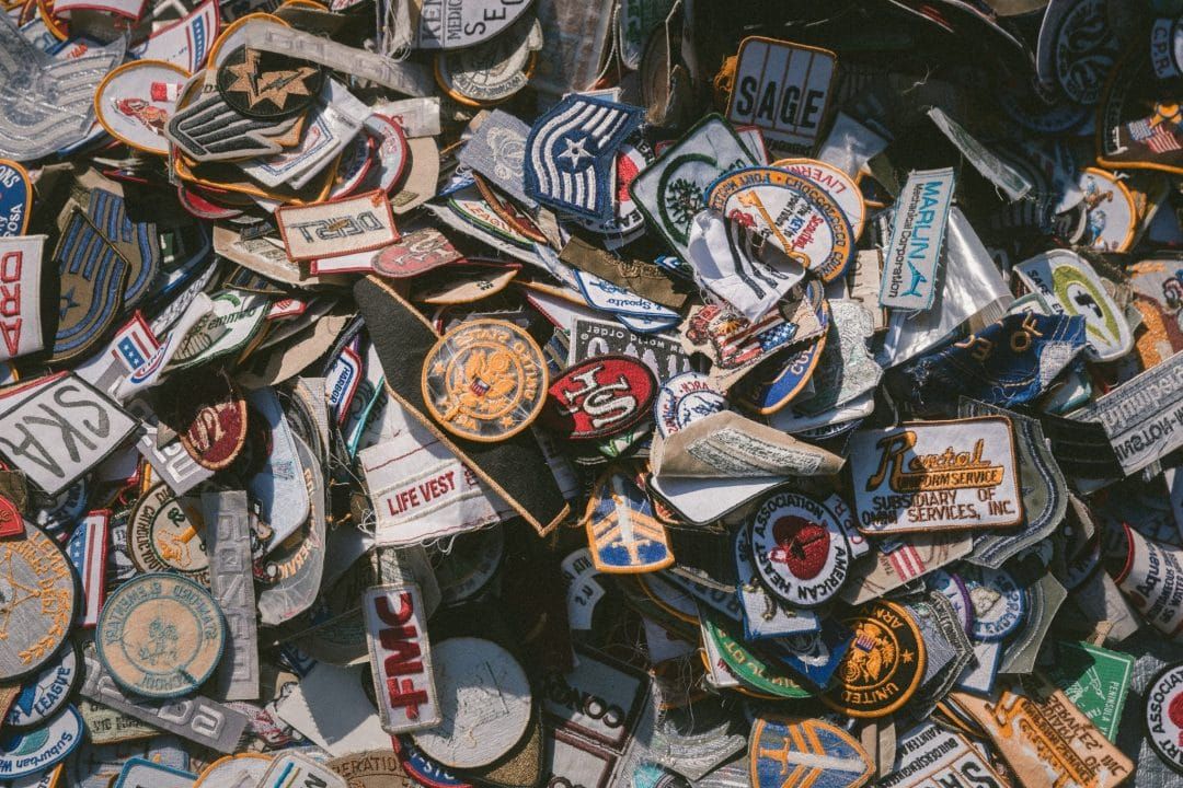 A close-up of a pile of vintage patches.