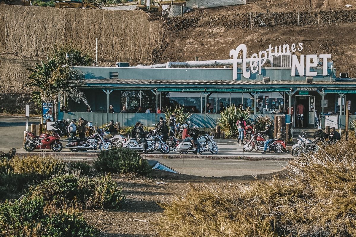 Neptune's Net, a retro, diner-style, turquoise building, with motorcycles parked out front.