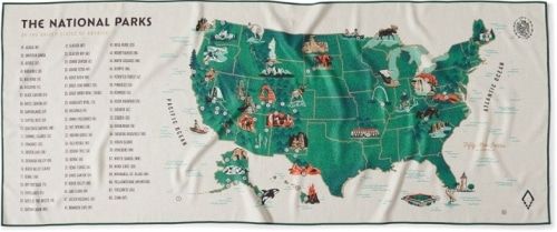 Nomadix National Parks Towel with a list of all national parks and a map of the US with cartoon images of the national parks on it.