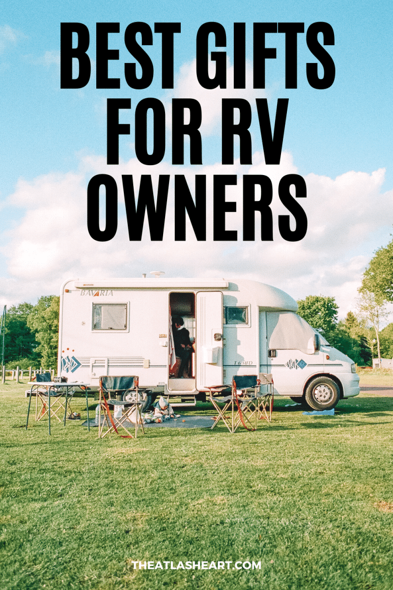 Best Gifts for RV Owners Pinterest pin with a black text overlay on an image with a white RV parked on a lawn on a sunny day.