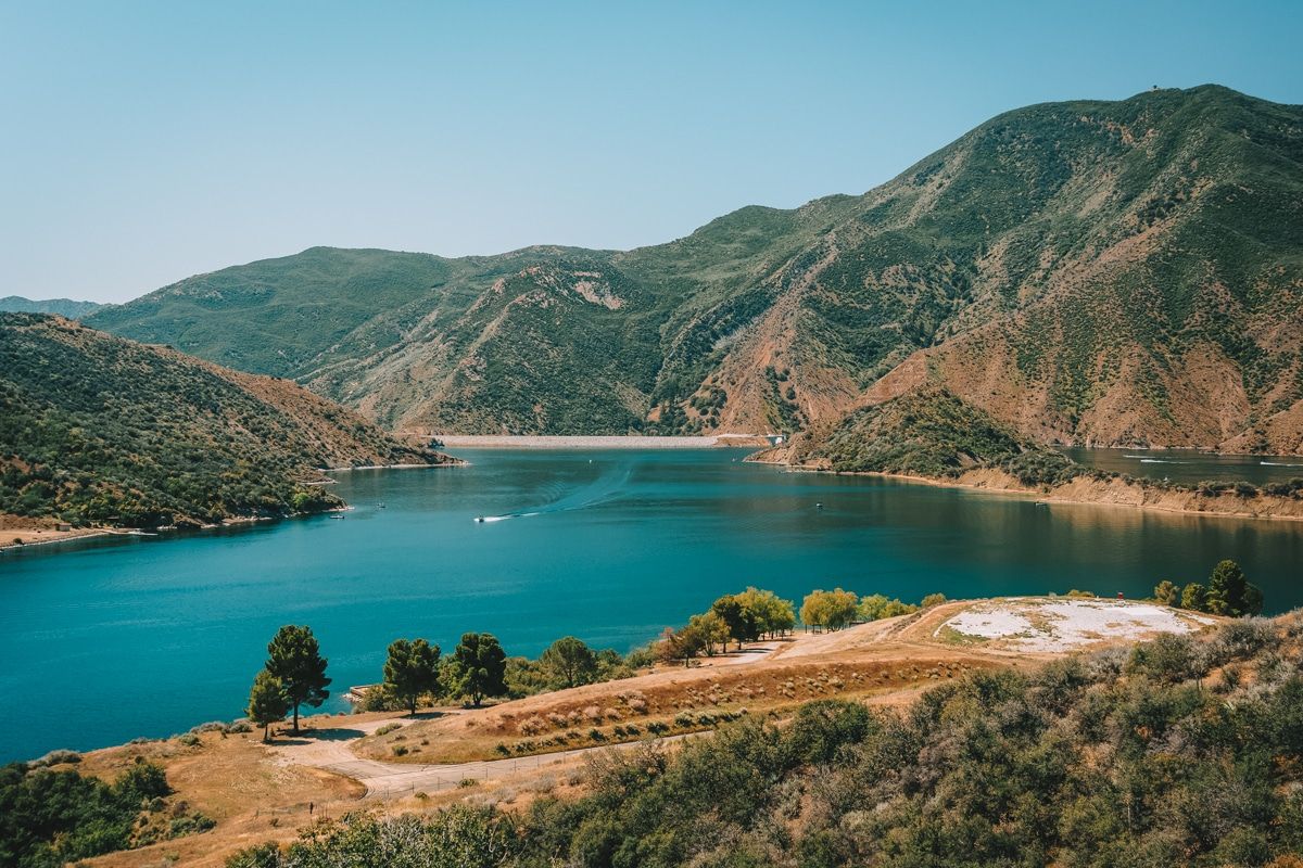 A lake surrounded by hills in the Angeles National Forest.