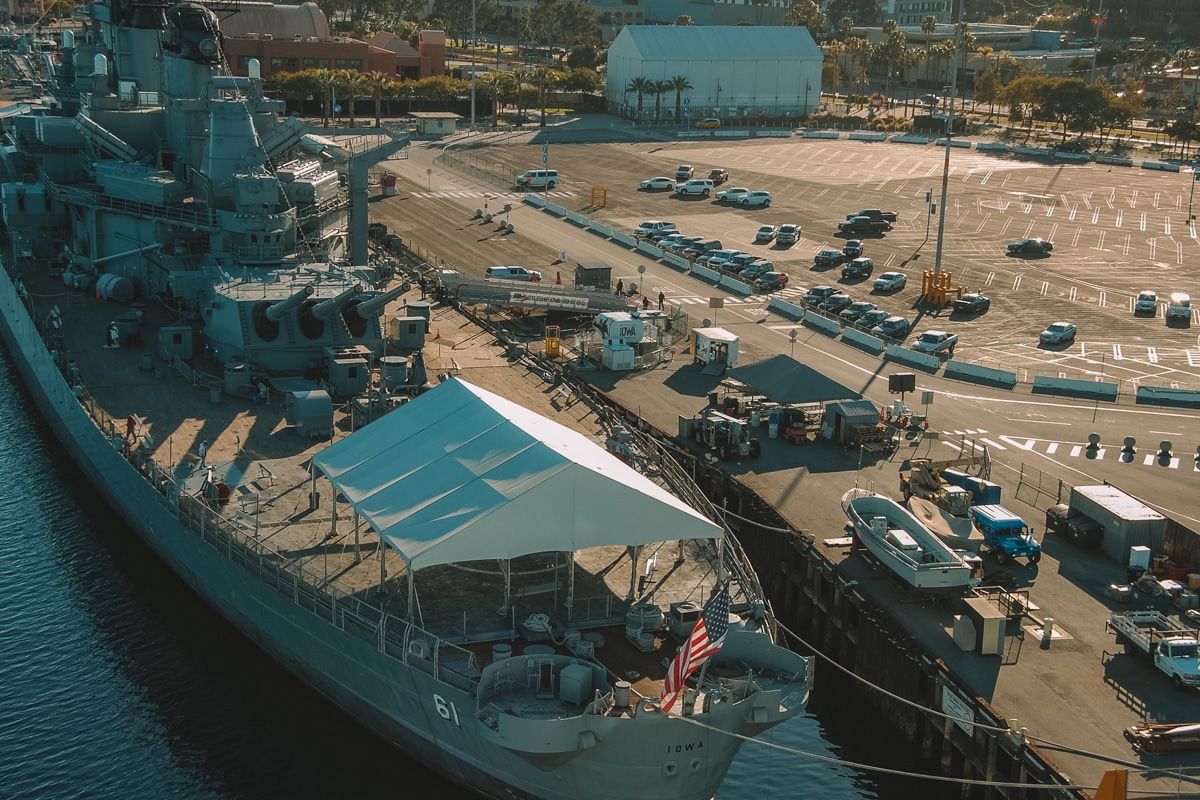 Overhead view of the Battleship Iowa Museum, housed in a decommissioned battleship docked at the harbor.
