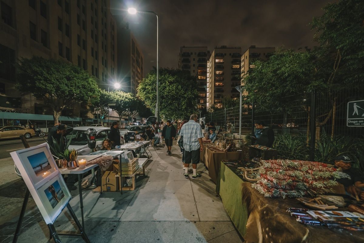 People enjoying a nighttime stroll through the Downtown Los Angeles Art Walk.