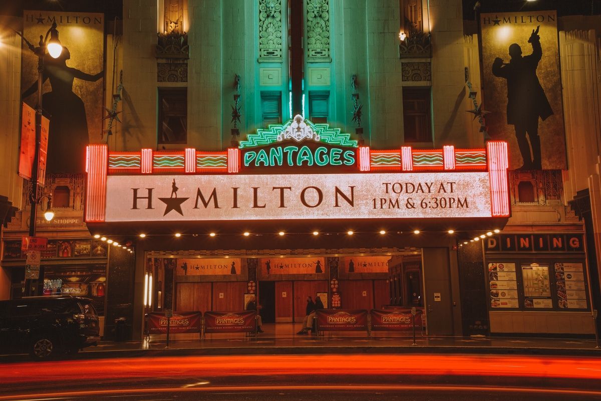 The lit-up marquee of the Pantages Theatre advertising 'Hamilton.'