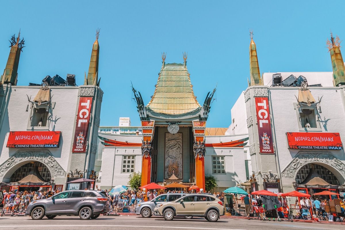 Cars and crowds gathered in front of the ornate entrance of the TCL Chinese Theatre.