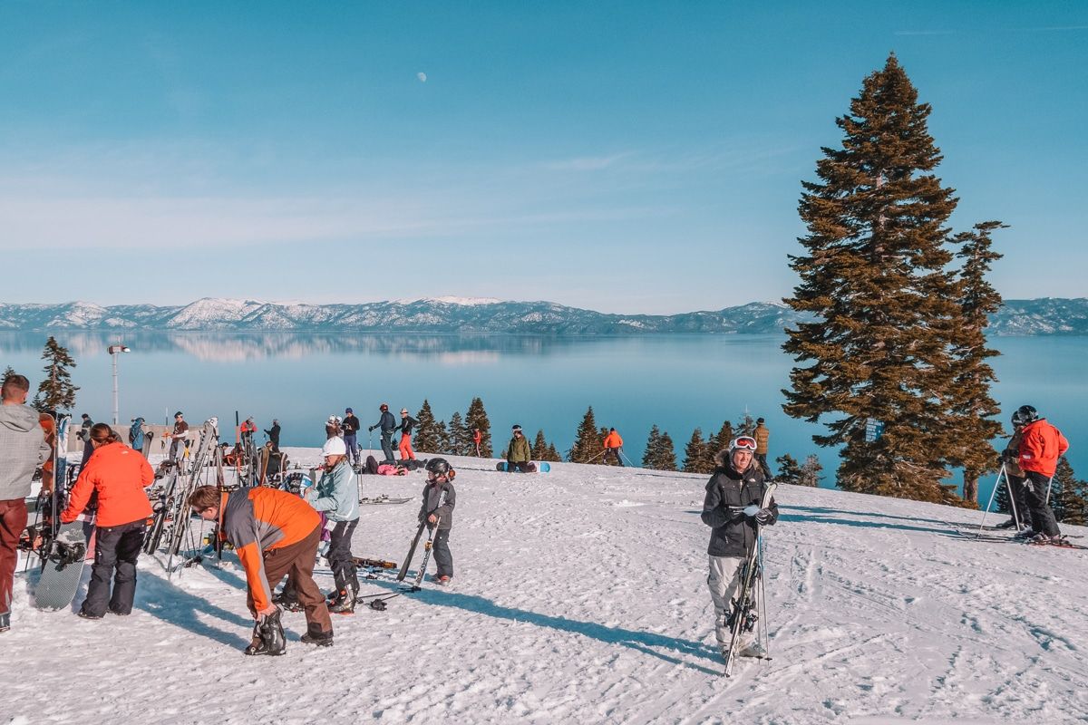 Group of skiers at Homewood Mountain Resort, looking over Lake Tahoe.