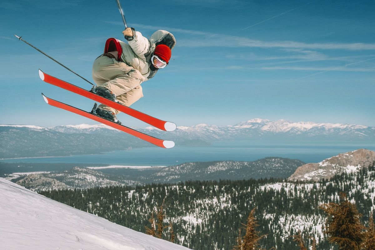 Downhill skier skiing down a mountain in Lake Tahoe.