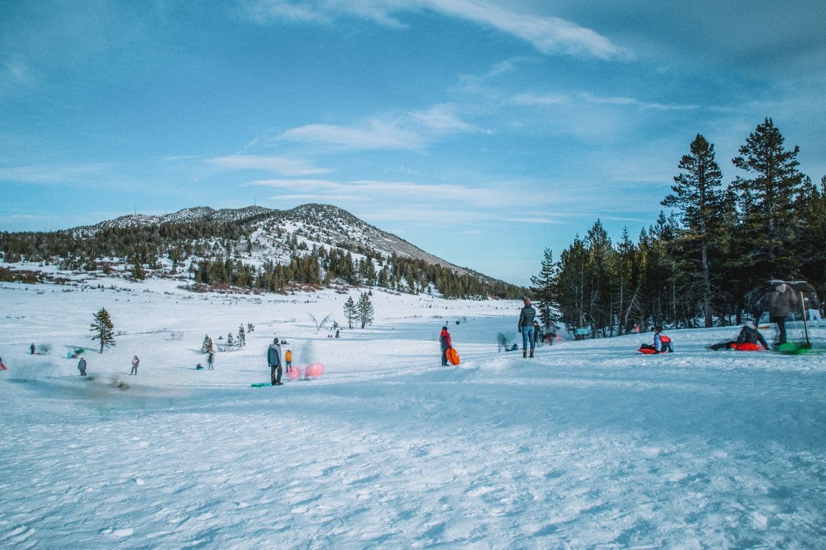 People sledding and tubing in the snow in Lake Tahoe