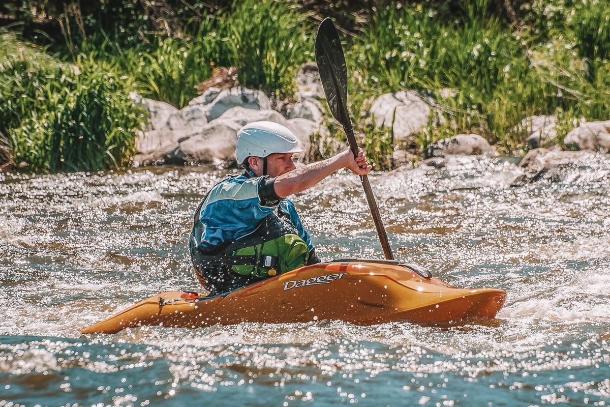 A picture of a man in the water in his Dagger whitewater kayak