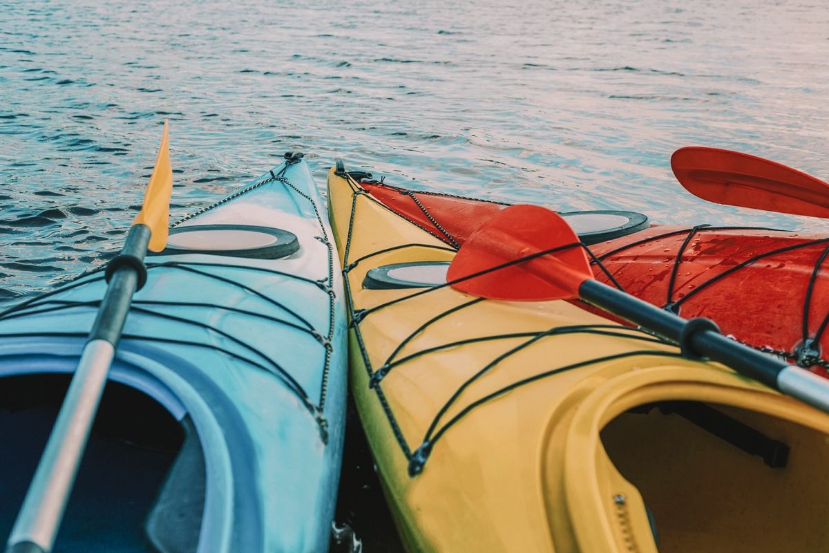 Sport kayaks on the lake shore