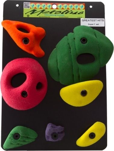 Product photo of Metolius Greatest Hits Super 7 Climbing Holds showing multicolored hand-holds on a black backing.