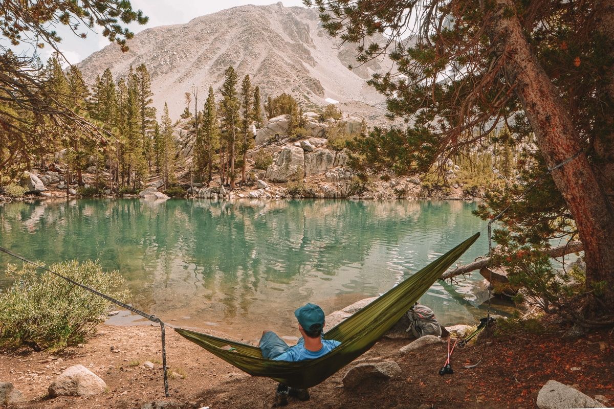 Picture of a man sitting on a hammock at Big Pine Lakes