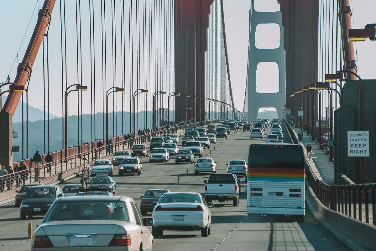 The traffic going across the Golden Gate Bridge on a hazy afternoon.