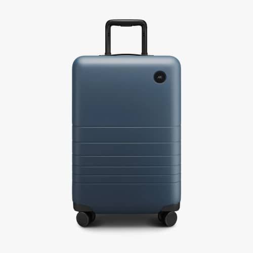 Product image for the Monos Carry-On Plus in dark blue.