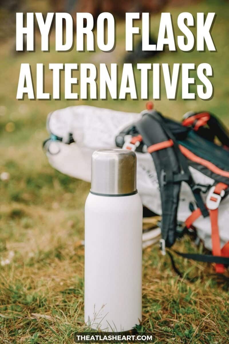 A white stainless steel bottle, sitting on grass with a hiking backpack behind it, with the text overlay, "Hydro Flask Alternatives."