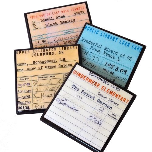 Four coasters, all with antiquated images of real stamped library due-date cards.