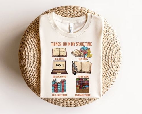 A cream-colored shirt with six images, "Things I do in my Spare Time." Below, images and text are: an open book with the description, "Read Books"; a pile of books and coins "Buy Books"; a laptop that says books "Research books";  an open book and feather pen "Review Books"; books binding out "Talk About Books"; and a book shelf full of books "Rearrange Books."