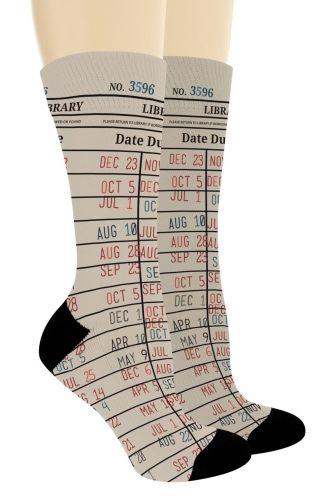 Beige socks printed with a Due Date card pattern, showing lines with multicolored stamped dates. The toes and heels are black.
