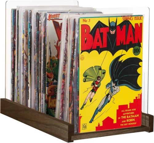 A fooden-bottomed display with clear book ends, full of comic books.