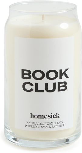 White candle in a glass container that's labeled "Book Club".