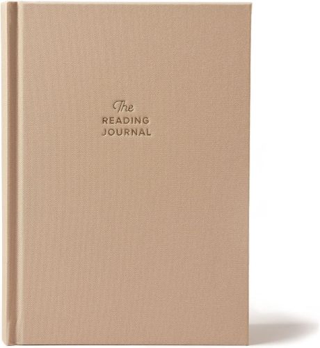 A tan journal with the cover text "The Reading Journal."