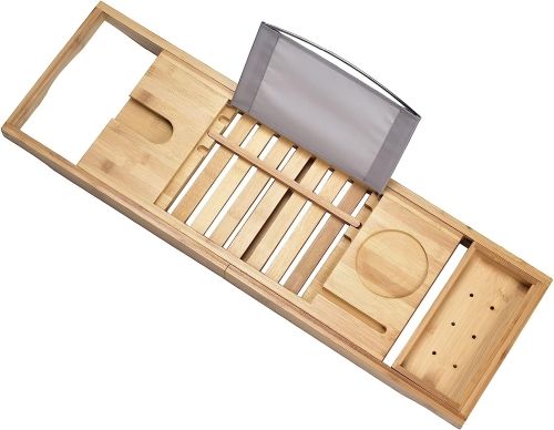 A wooden tray with variously-sized cutouts and a grey holder for propping up a book.