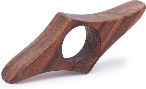 A wooden tool that looks like a squished cube with a hole in the center.