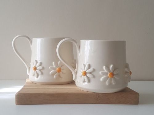 Product photo for the Daisy Mugs on a white background.
