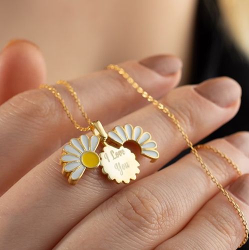 Product photo for the Daisy Necklace, inscribed with the words, "I love you," in script.