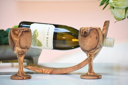 Product photo for the Wooden Chalice Glasses, shown with a bottle of white wine.