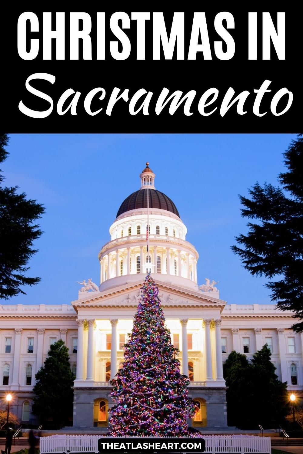 A view of the Capitol Building in the early evening during Christmas in Sacramento, with an illuminated Christmas tree in the foreground, with the text overlay, "Christmas in Sacramento."