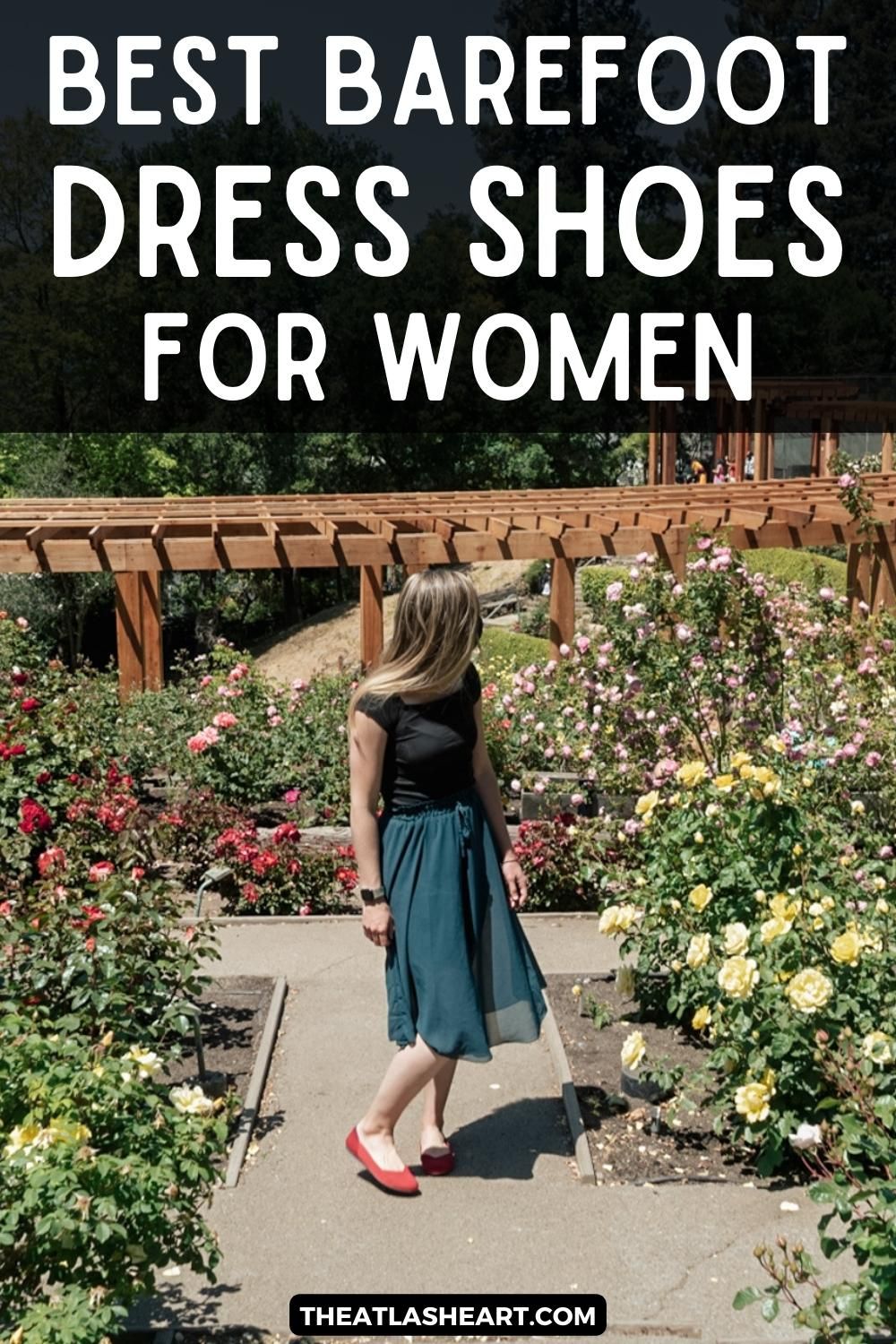 A light-haired woman wearing a turquoise skirt and red flats looks away from the camera over her shoulder as she stands on a path in a sunny rose garden, with the text overlay, "Best Barefoot Dress Shoes for Women."