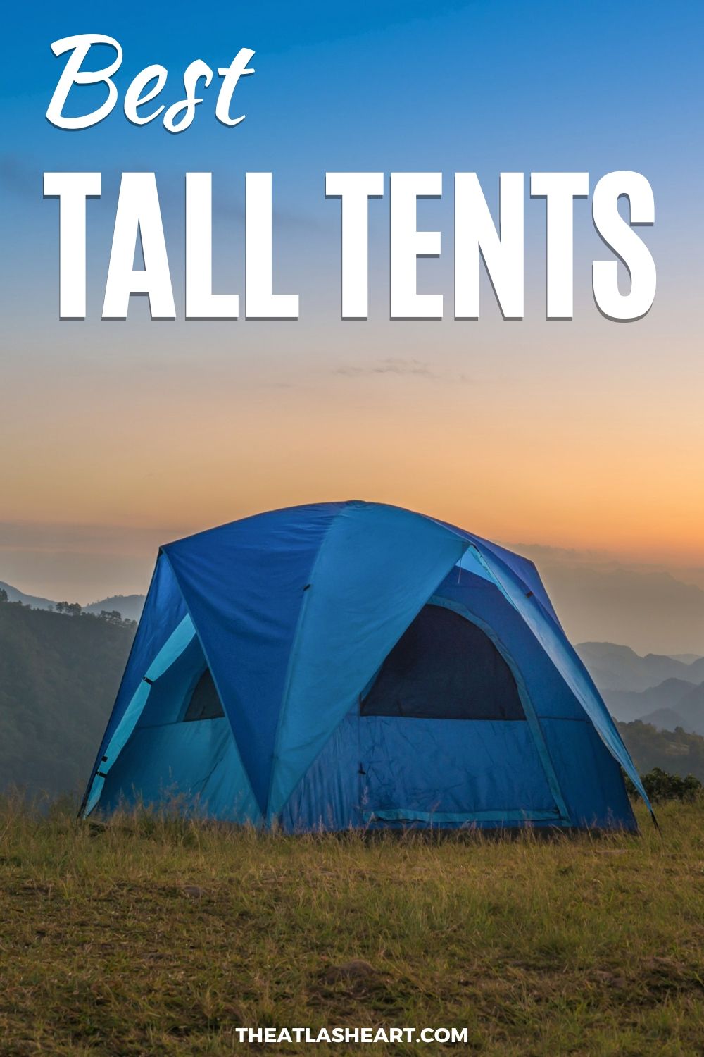 Best Tall Tents Pin
A blue tent with a rain fly set up on a grassy hill in front of mountain ranges that are silhouetted by a sunrise or sunset, with the text overlay, "Best Tall Tents."