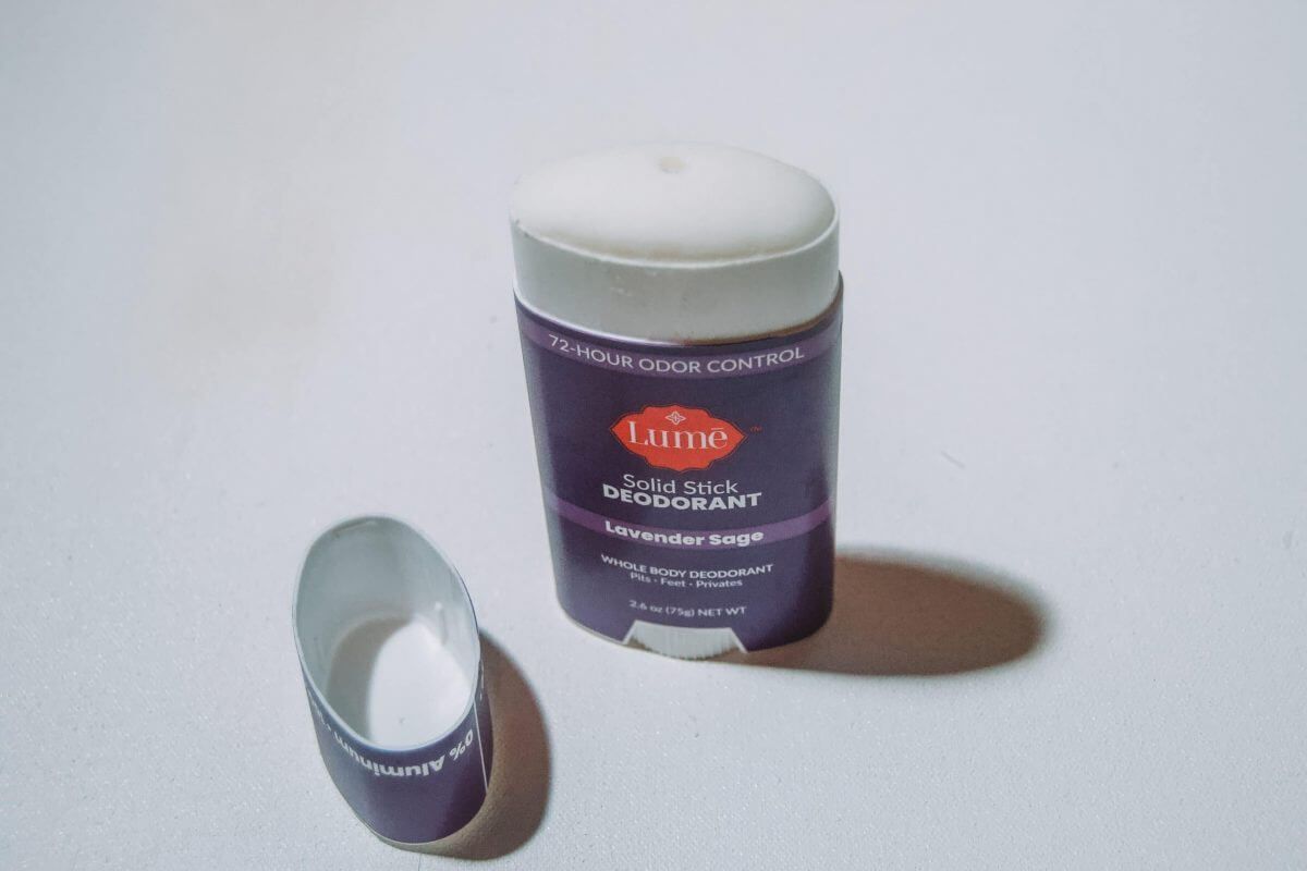 A solid stick of Lavender Sage Lume Deodorant on a white background.