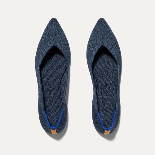 Product photos for the Rothys The Point in navy blue.
