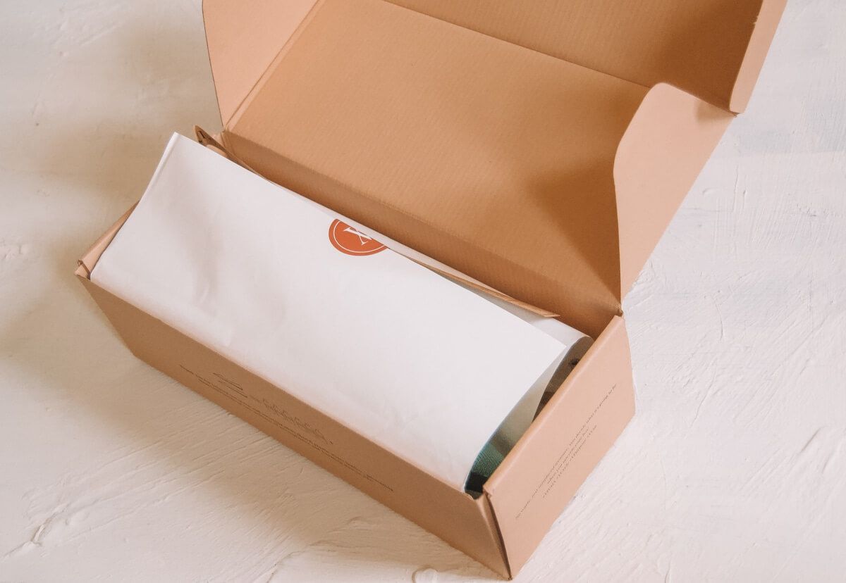 A Vivaia shoebox sitting open on a white background.
